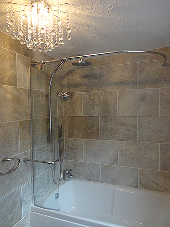 The completed bath, shower & ceiling chandellier