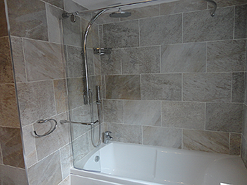 The wall tiles were laid in a contemporary brick bond design