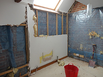 Interior walls stripped back to brick prior to insulation replastering 1
