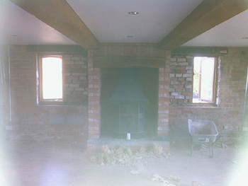 
The living room during demolition of the chimney breast