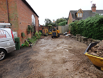 Preparing the rear patio area for new Indian Stone paving slabs