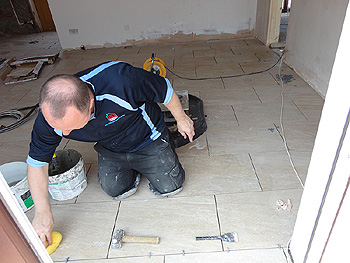 Grouting the floor tiles