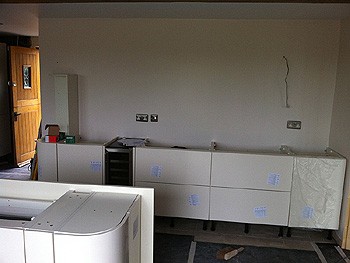 The remainder of the kitchen floor cupboards are installed