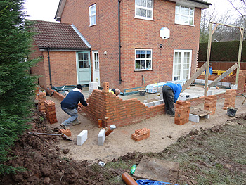 The bricklayers get to work