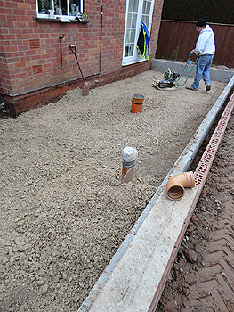 Compacting the base of the extension floor