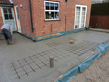 The concrete base is poured on top