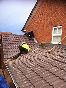 Finishing off the roof tiling and flashing