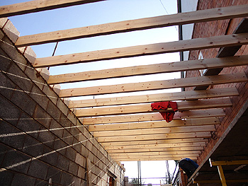 The first floor joists are secured into position